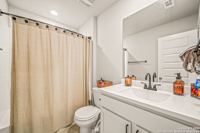 bathroom featuring walk in shower, vanity, and toilet