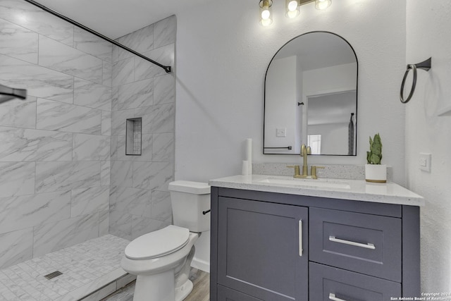 4207 High Sierra, San Antonio, TX 78228 - full bath with toilet, a tile shower, vanity, and wood finished floors