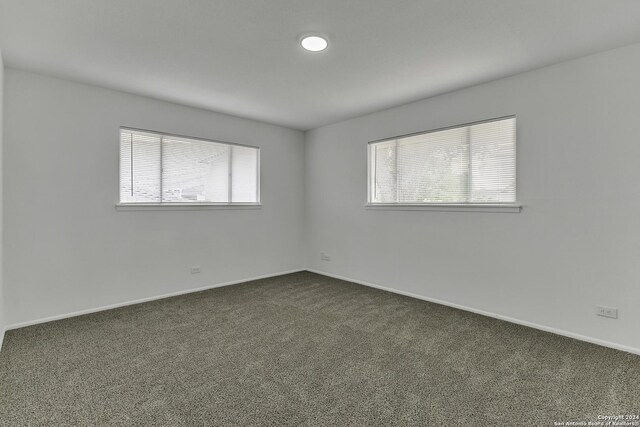 4207 High Sierra, San Antonio, TX 78228 - spare room with dark colored carpet and baseboards