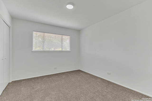 empty room with carpet flooring