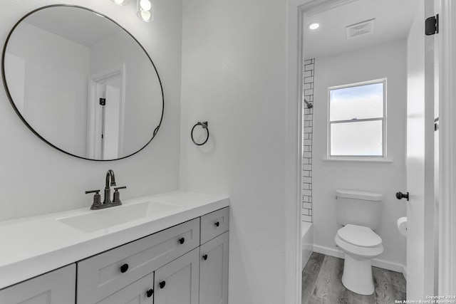 4207 High Sierra, San Antonio, TX 78228 - bathroom featuring vanity, toilet, wood finished floors, and baseboards