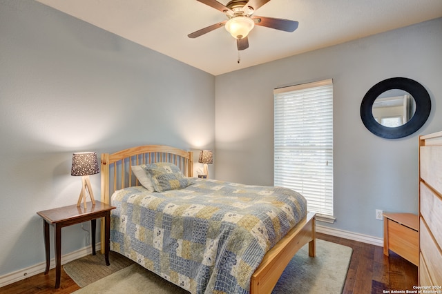 bedroom with dark wood-type flooring and ceiling fan