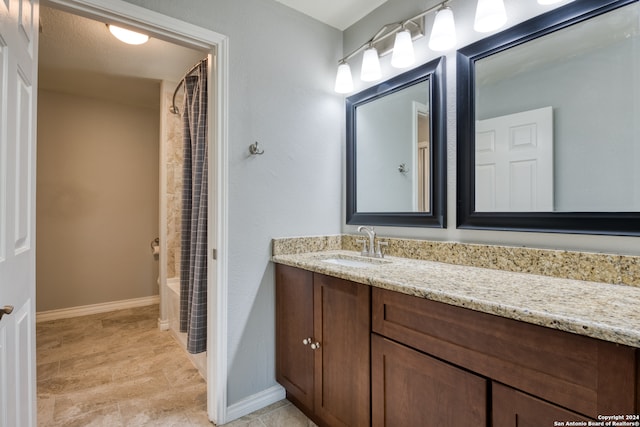 bathroom featuring vanity, shower / tub combo, and a textured ceiling