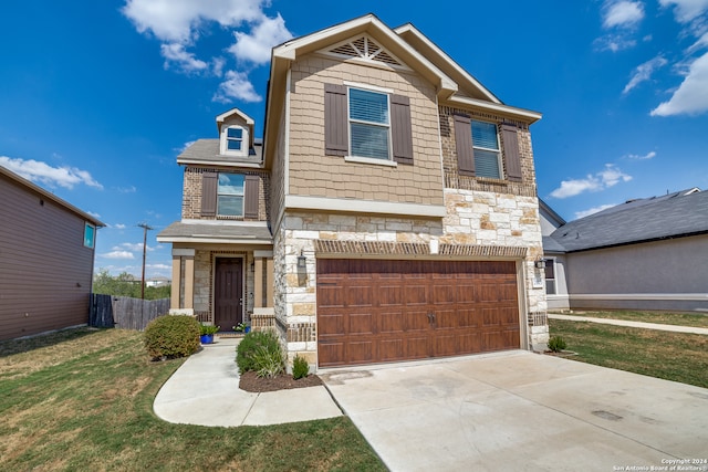 view of front facade with a front yard and a garage