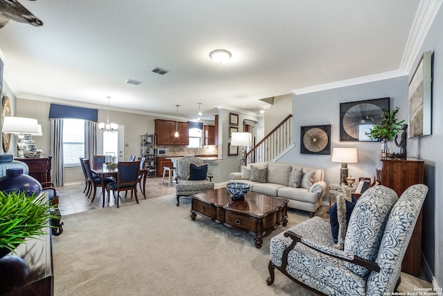 carpeted living room featuring a notable chandelier, ornamental molding, and a healthy amount of sunlight