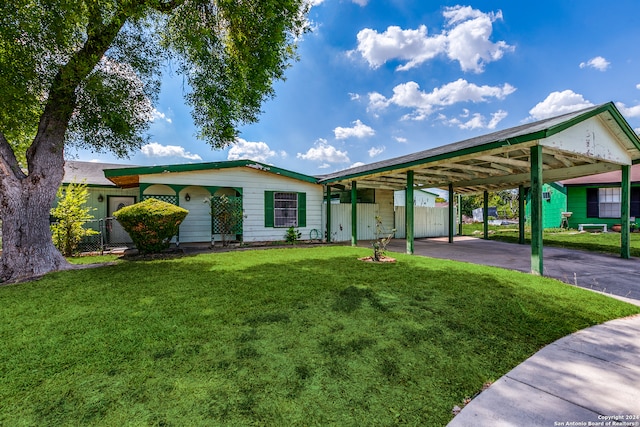 single story home featuring a front yard and a carport