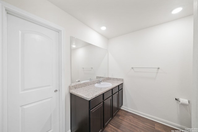 bathroom featuring hardwood / wood-style floors and vanity