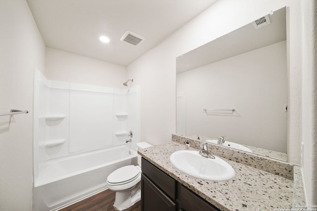 full bathroom with vanity, toilet, shower / bath combination, and hardwood / wood-style flooring