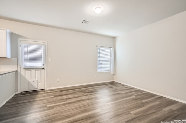 spare room featuring dark hardwood / wood-style floors