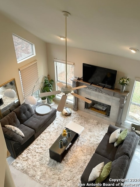 living room with a tile fireplace