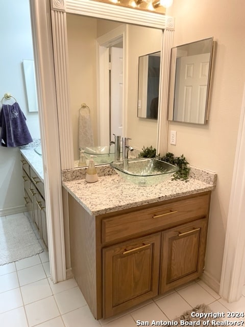 bathroom with vanity and tile patterned floors