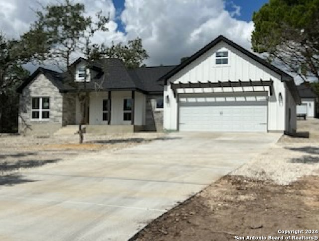 modern farmhouse style home featuring a garage