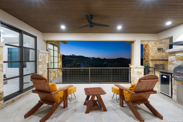 exterior space featuring ceiling fan, a fireplace, and wooden ceiling