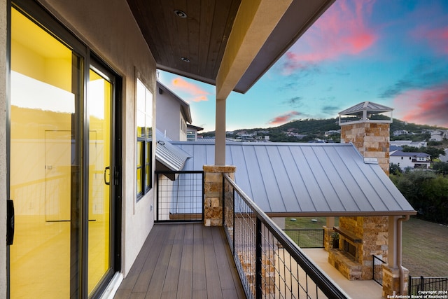 view of balcony at dusk