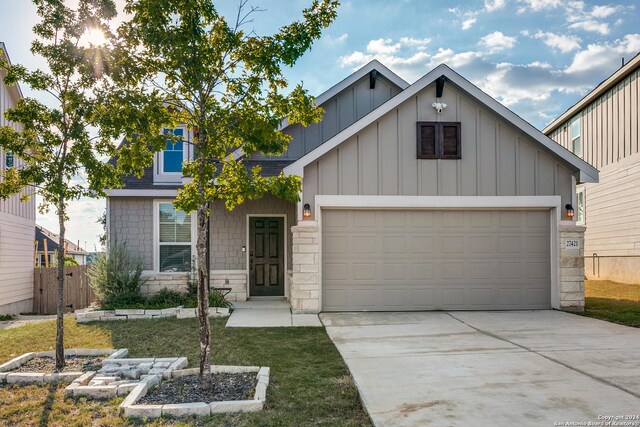 view of front of house with a front lawn and a garage