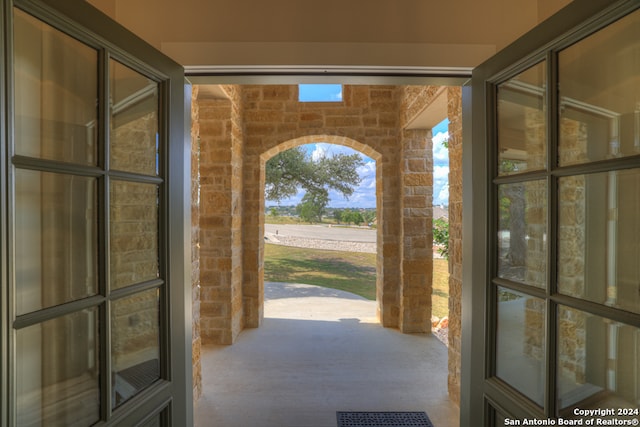 doorway to outside with carpet flooring