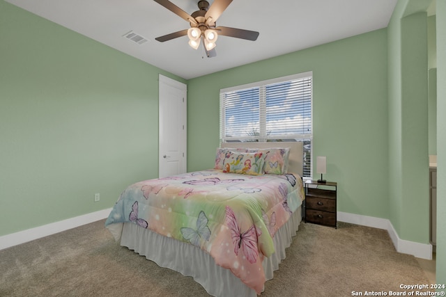 bedroom featuring ceiling fan and light colored carpet