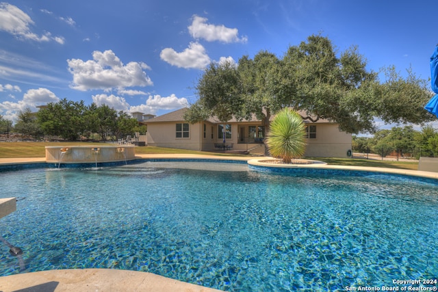 view of pool featuring a patio and pool water feature