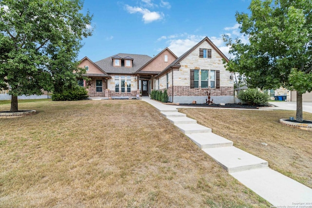 craftsman-style house featuring a front lawn