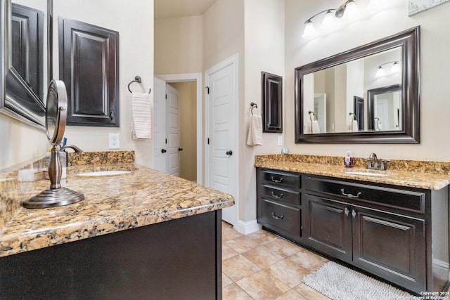 bathroom with vanity and tile patterned flooring