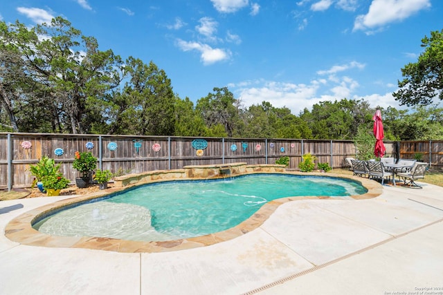 view of pool featuring pool water feature and a patio area