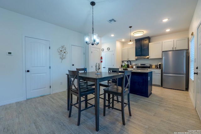 dining room with light hardwood / wood-style floors