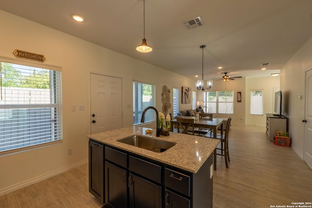 kitchen featuring light hardwood / wood-style floors, sink, and a wealth of natural light