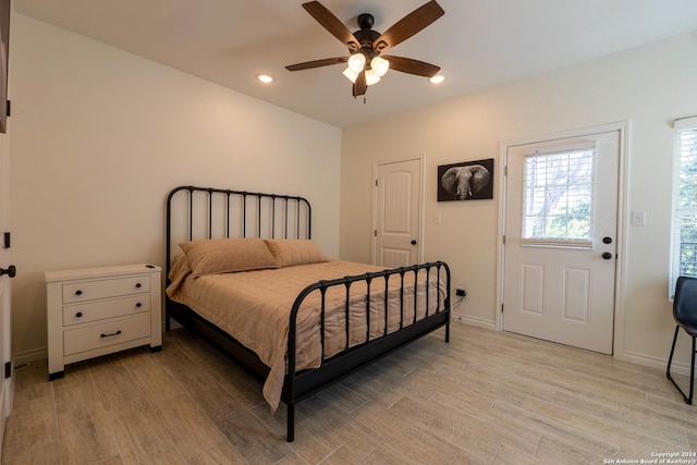 bedroom featuring light hardwood / wood-style flooring and ceiling fan