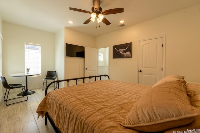 bedroom featuring light wood-type flooring and ceiling fan