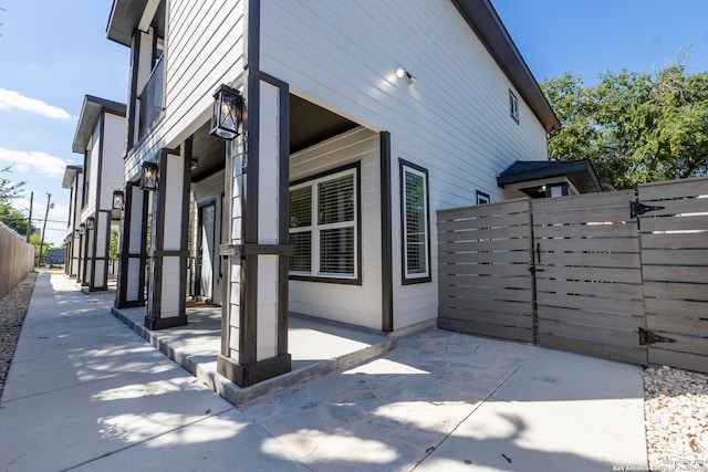 view of property exterior featuring a patio area