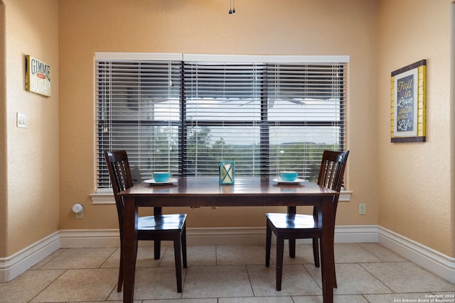 dining space with light tile patterned flooring