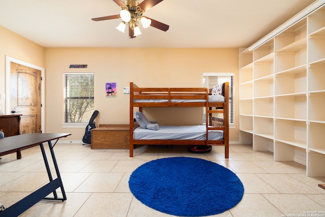 tiled bedroom with ceiling fan