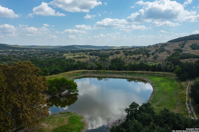 aerial view featuring a water and mountain view