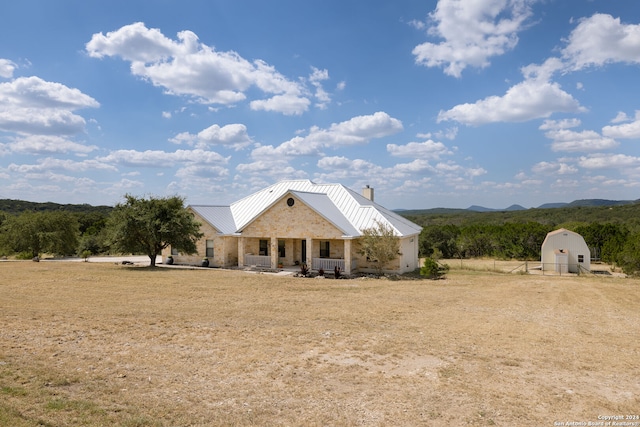 view of front facade with a shed