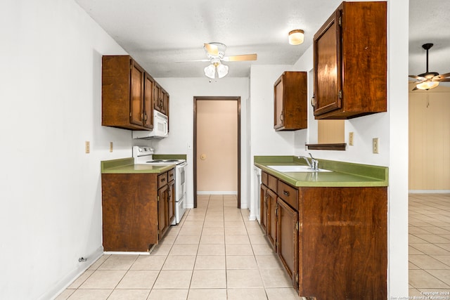 kitchen with white appliances, ceiling fan, light tile patterned flooring, and sink