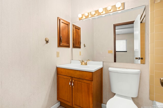 bathroom with vanity and toilet