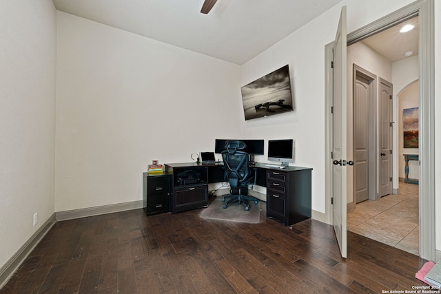 home office with wood-type flooring and ceiling fan