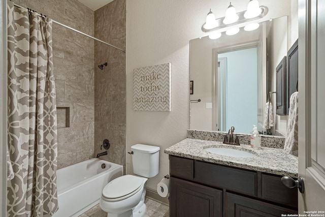 full bathroom with tile patterned floors, shower / bath combo, vanity, and toilet