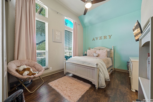 bedroom with vaulted ceiling, ceiling fan, and dark hardwood / wood-style flooring