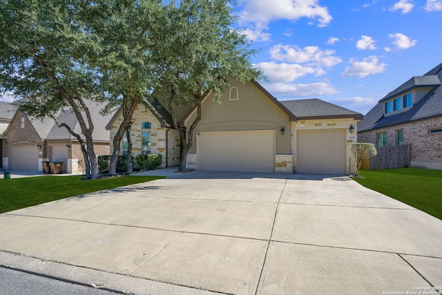 view of front facade with a front yard and a garage