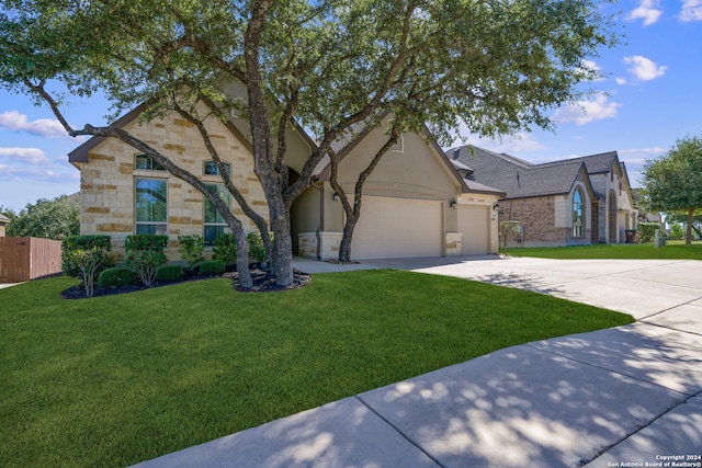 view of front facade featuring a front yard and a garage