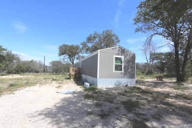 view of home's exterior featuring an outbuilding