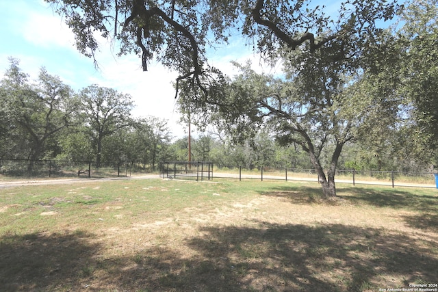 view of yard with a rural view