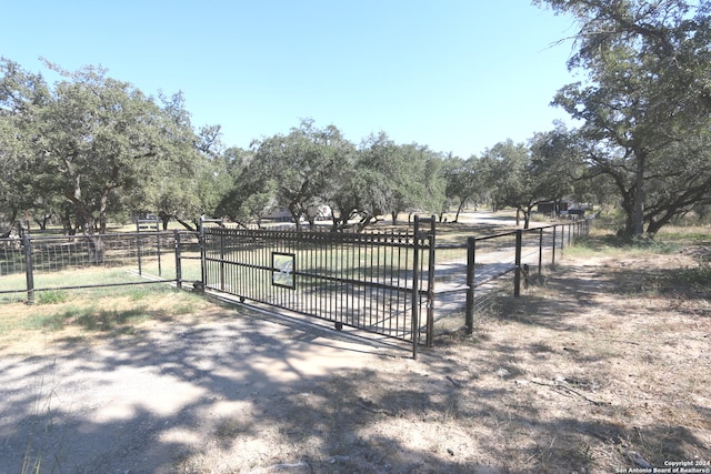 view of gate featuring a rural view