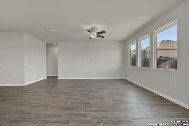 empty room featuring ceiling fan and light hardwood / wood-style flooring