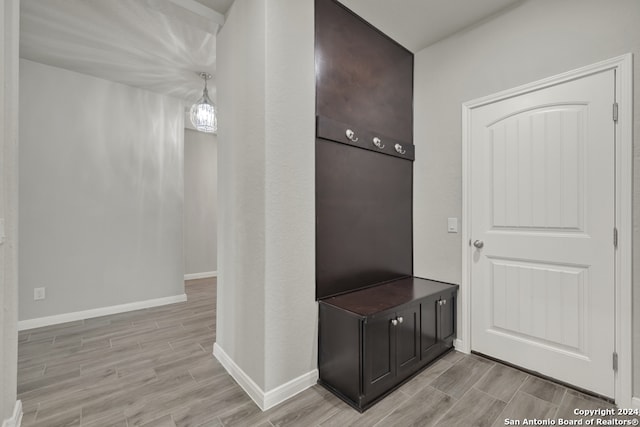 mudroom with light hardwood / wood-style flooring