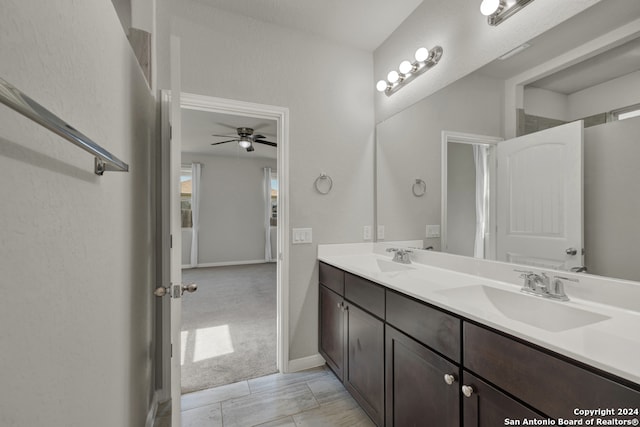 bathroom featuring ceiling fan and vanity