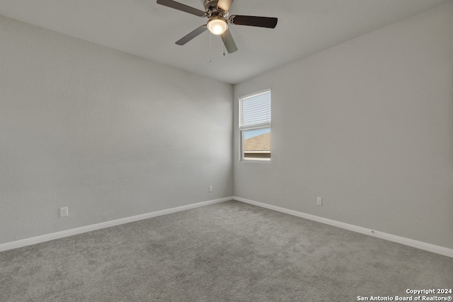 carpeted empty room with ceiling fan