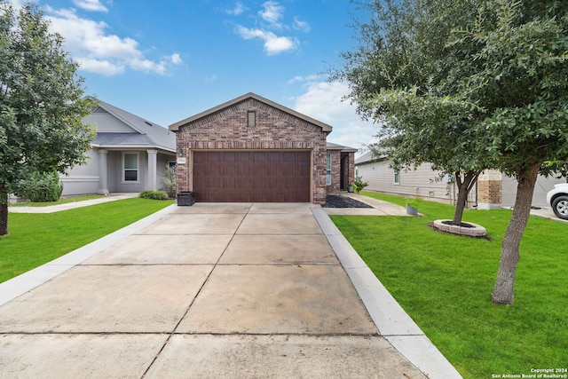 view of front of property featuring a garage and a front lawn