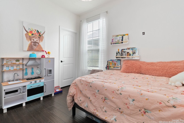 bedroom featuring dark hardwood / wood-style floors